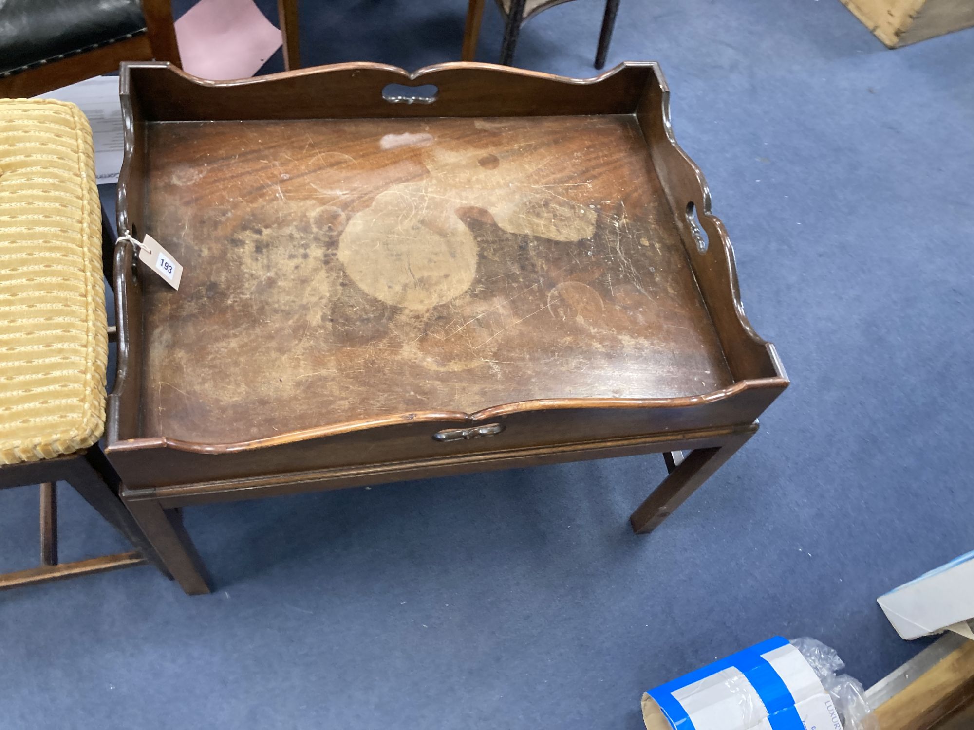 A butlers tray table, width 78cm depth 56cm height 54cm, and a Georgian mahogany stool